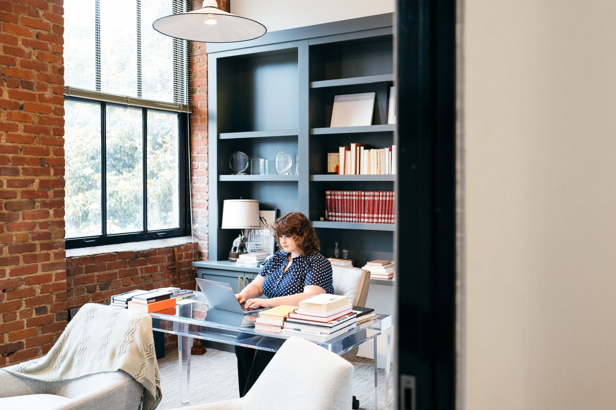 Business owner reviewing a spreadsheet on a laptop