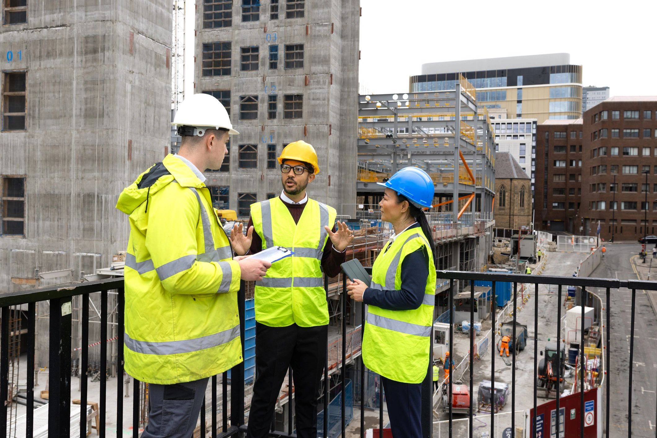 Small service-business professionals reviewing plans together at a job site
